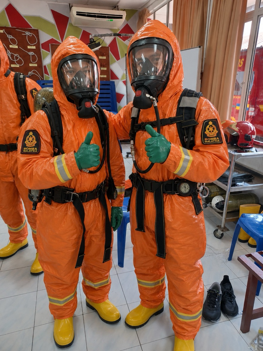 Otti's instructors in BOMBA gear and breathing apparatus during Fire & Rescue training