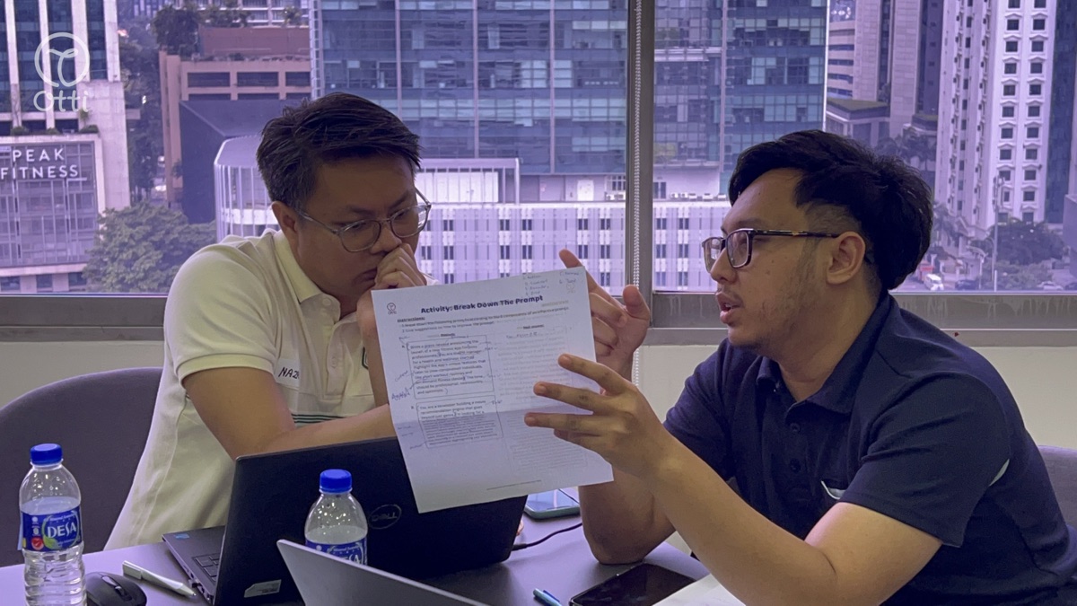 Two professionals reviewing HRD Corp paperwork together